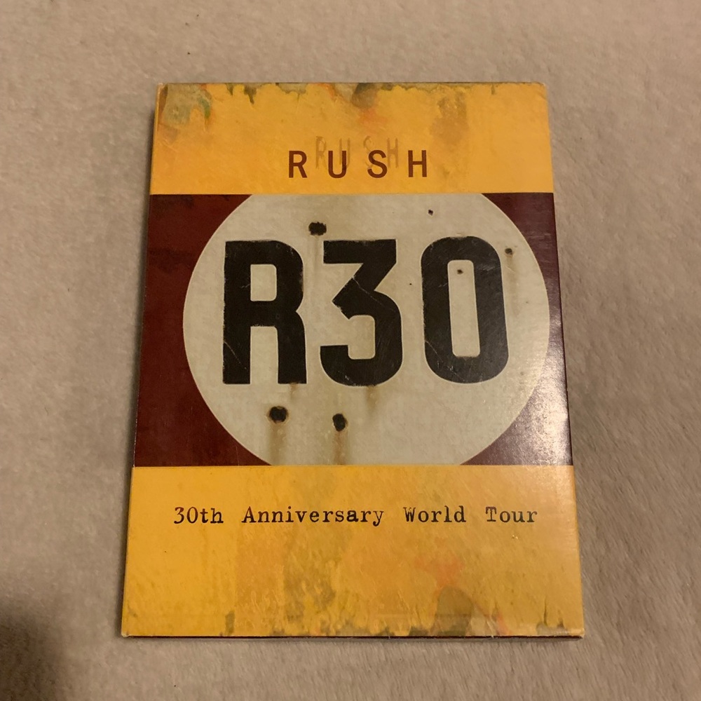 Rush r30 dvd cd set with guitar picks included. EUC